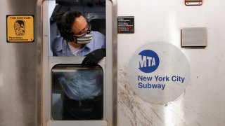 An MTA worker is seen wearing a mask on the subway after The Port Authority of New York and New Jersey and the Metropolitan Transportation Authority (MTA) announced a mandatory coronavirus vaccination or weekly test mandate for employees in New York City, New York, August 2, 2021.