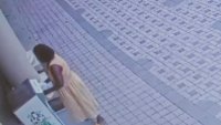 Surveillance video shows a woman believed to be a city employee dropping ballots in a box.
