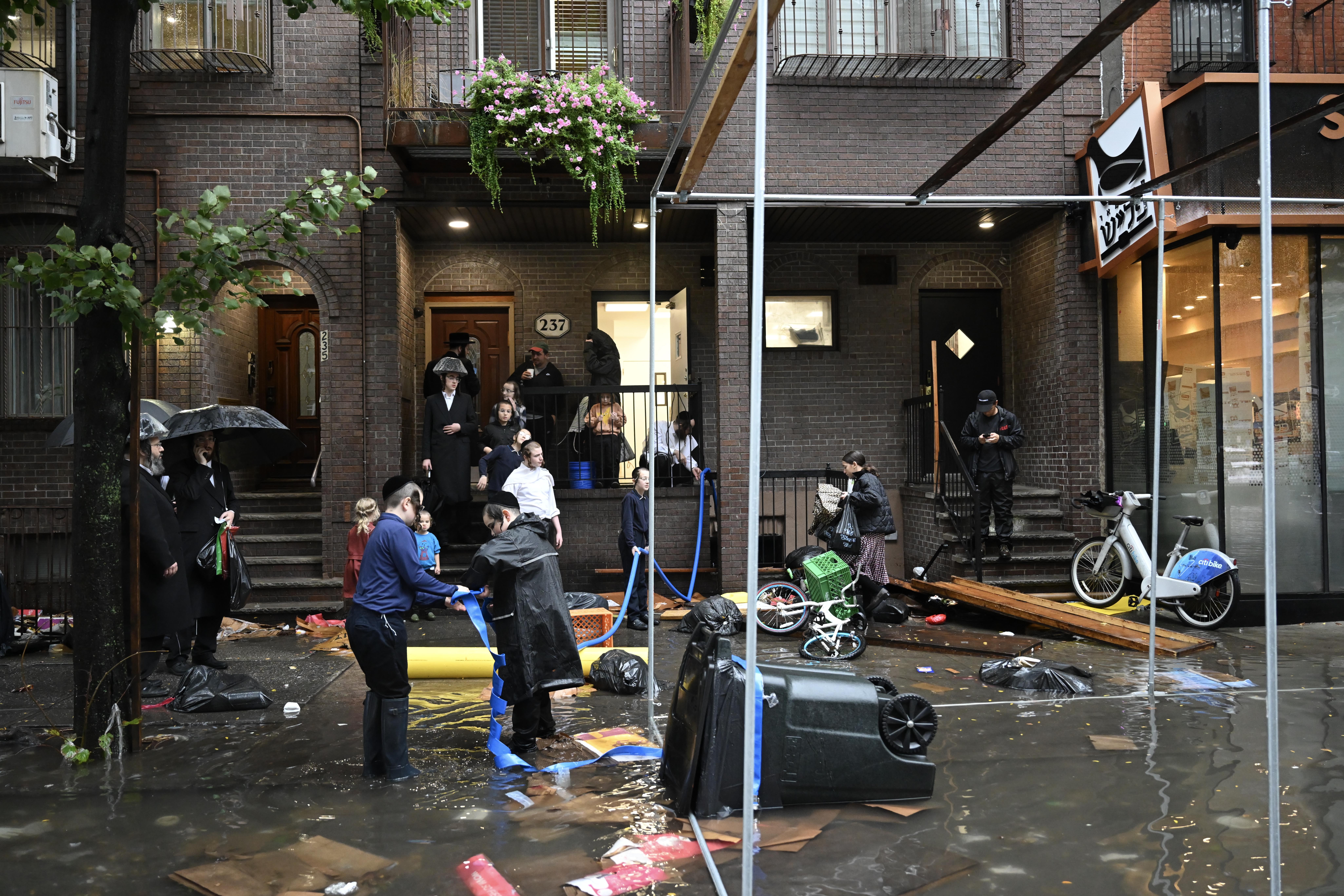 Stunning photos capture how several inches of rain brought New York City to a halt