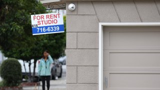 A sign is posted in front of an apartment building with available rentals on June 09, 2023 in San Francisco, California. 