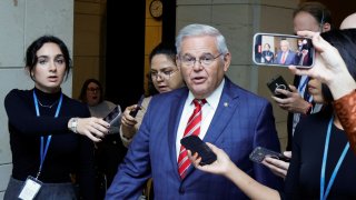 U.S. Senator Robert Menendez is trailed by reporters after departing the Senate Democratic Caucus, following his arraignment on corruption charges, at the U.S. Capitol in Washington, D.C., on Sept. 28, 2023.