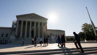Visitors walk across the U.S. Supreme Court plaza on the first day of the court’s new session on Oct. 2, 2023.