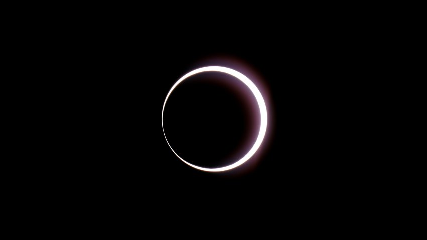 The moon passes between earth and the sun during a rare "ring of fire" eclipse of the sun