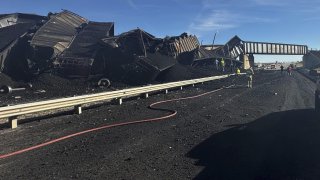 In this photo released by the Pueblo County Sheriff’s Office, police respond to the scene of a train derailment near Pueblo, Colo., Sunday, Oct. 15, 2023.