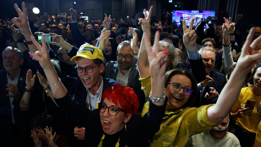 Supporters of the Third Way, a coalition of the centrist Poland 2050 party and the agrarian Polish People's Party, celebrate at the electoral headquarters in Warsaw, Poland, Oct. 15, 2023.