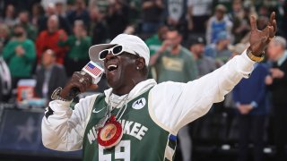 Flavor Flav sings the national anthem before the Atlanta Hawks vs. Milwaukee Bucks game on Oct. 29, 2023, at the Fiserv Forum Center in Milwaukee.