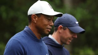 Tiger Woods of the United States and Rory McIlroy of Northern Ireland walk to the 11th fairway during a practice round prior to the 2023 Masters Tournament at Augusta National Golf Club on April 03, 2023 in Augusta, Georgia.