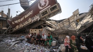 A view of a partially collapsed, still operational bakehouse in Nuseirat refugee camp in Deir al Balah, Gaza as civilians line up for bread on November 02, 2023.