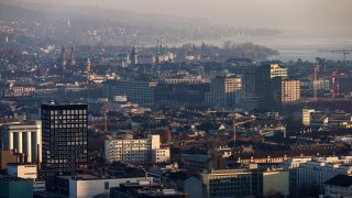 Commercial and residential properties stand on the city skyline in Zurich, Switzerland, on Wednesday, Nov. 11, 2015.