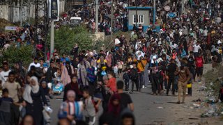 Palestinians flee to the southern Gaza Strip on Salah al-Din Street in Bureij, Gaza Strip, Friday, Nov. 10, 2023.