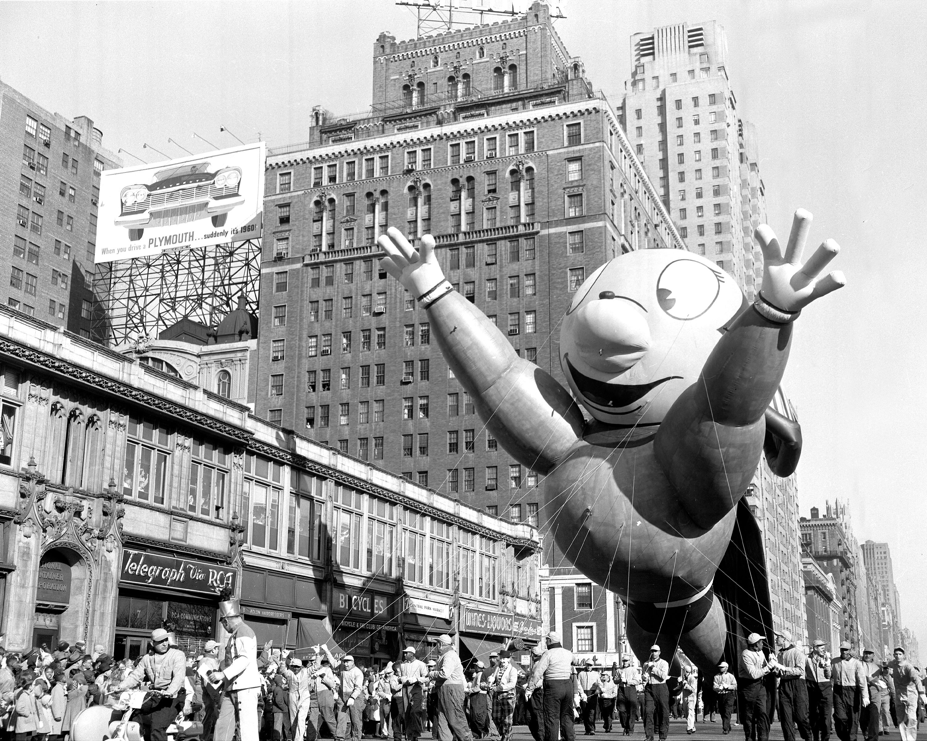 Might Mouse makes a spectacle of himself at Macy’s Thanksgiving Day parade.  (Photo by Hal Mathewson/NY Daily News Archive via Getty Images)