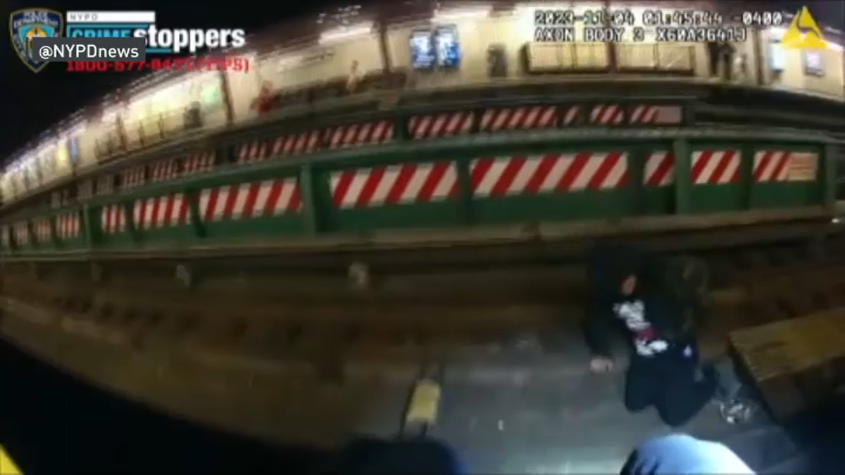 NYC: Body cam captures rescue of man who falls onto Queens subway ...