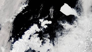 On November 27, 2023, a break in the swirling cloud cover allowed a glimpse of the Earth’s largest iceberg drifting past the tip of the Antarctic Peninsula.