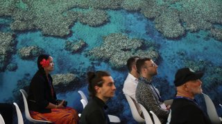 Participants attend a presentation at the Moana Blue Pacific pavilion of Pacific islands prior to the opening ceremony of the UNFCCC COP28 Climate Conference at Expo City Dubai on November 30, 2023 in Dubai, United Arab Emirates. 