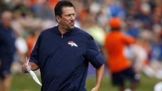 FILE - In this Aug. 4, 2016, file photo, Denver Broncos quarterbacks coach Greg Knapp watches during NFL football training camp in Englewood, Colo. New York Jets coach Robert Saleh and several team staffers, along with members of the Atlanta Falcons honored the late Greg Knapp by running the steps inside MetLife Stadium before the teams' game Sunday, Dec. 3, 2023. (AP Photo/David Zalubowski, File)