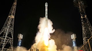 This photo provided by the North Korean government shows what the country said is the launch of the Malligyong-1, a military spy satellite, into orbit.