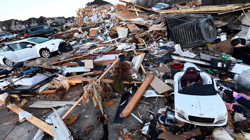 Debris covers the area around homes destroyed in the West Creek Farms neighborhood