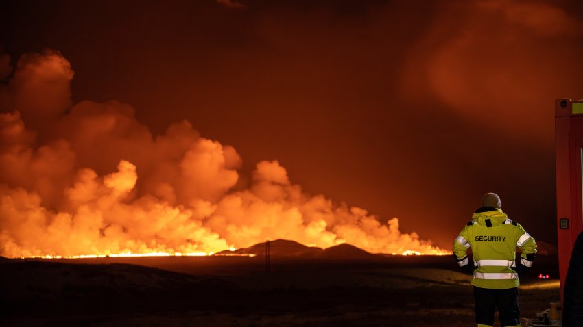 A volcanic eruption is seen, turning the sky orange, in Grindavik on Iceland’s Reykjanes Peninsula, Monday, Dec. 18, 2023.