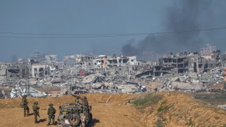 Israeli army troops are seen near the Gaza Strip border.