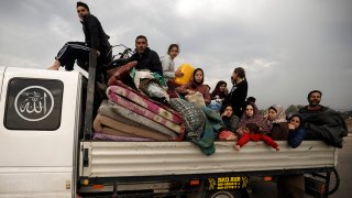 Palestinians flee the Israeli ground offensive in Khan Younis, Gaza Strip, Dec. 27, 2023.