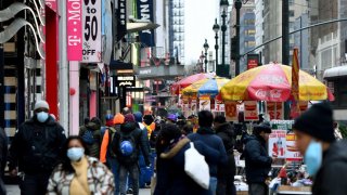 People walking through New York City.