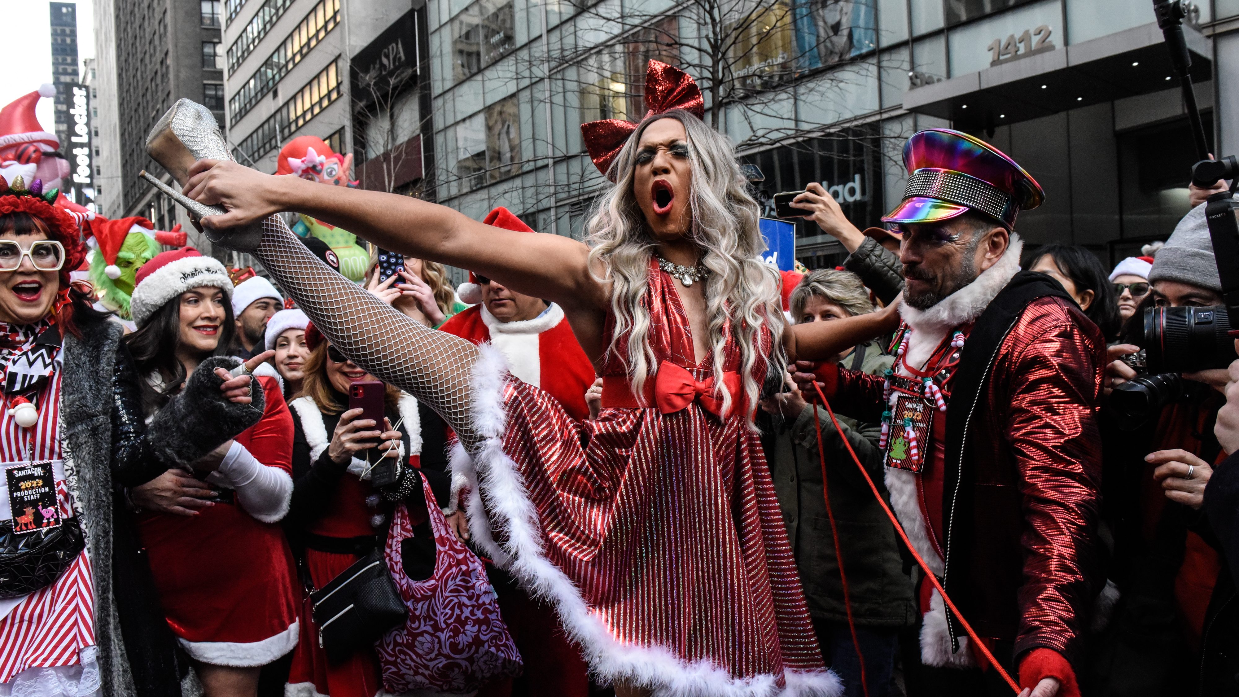 Revelers dressed as holiday characters participate in the annual SantaCon pub crawl on December 9, 2023 in New York City. While ostensibly raising money for charity, the event has been criticized for widespread drunkenness and sporadic violence. (Photo by Stephanie Keith/Getty Images)