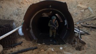 An Israeli soldier exits a tunnel near the border with Israel on December 15, 2023