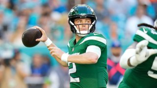 Zach Wilson #2 of the New York Jets throws a pass during the first half against the Miami Dolphins at Hard Rock Stadium on December 17, 2023 in Miami Gardens, Florida. (Photo by Rich Storry/Getty Images)