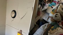 Photos released by Miami Fire Rescue show a hole in the floor and cracked walls at a home in Little Havana.