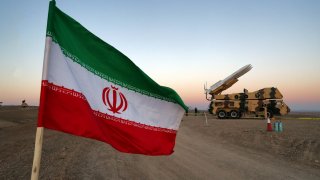 An Iranian flag is pictured near in a missile during a military drill, with the participation of Iran’s Air Defense units, Iran October 19, 2020.