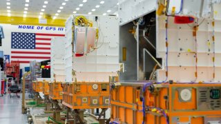 Lockheed Martin’s Tranche 0 Transport Layer satellites are seen in one of the company’s processing facilities.