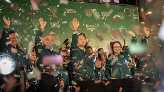 Taiwan’s president- and vice president-elect from the Democratic Progressive Party Lai Ching-te and Hsiao Bi-khim standing along several party’s heavyweight on the central stage in Taipei on Janauary 13, 2024 to celebrate victory in Taiwan’s 8th presidential election.