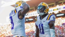 OXFORD, MISSISSIPPI - SEPTEMBER 30: Wide receiver Brian Thomas Jr. #11 of the LSU Tigers celebrates with wide receiver Malik Nabers #8 of the LSU Tigers after scoring a touchdown during the first half of their game against the LSU Tigers against the Mississippi Rebels at Vaught-Hemingway Stadium on September 30, 2023 in Oxford, Mississippi. (Photo by Michael Chang/Getty Images)