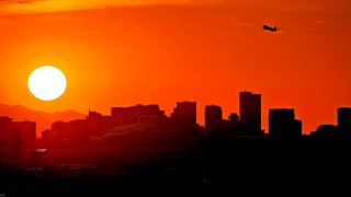 Orange sky behind Phoenix skyline