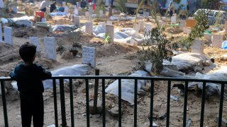 Graves of people killed in Gaza
