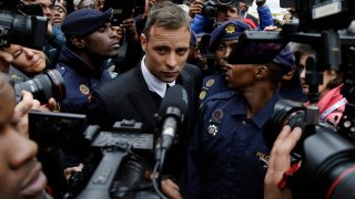 Oscar Pistorius leaves the High Court in Pretoria, South Africa