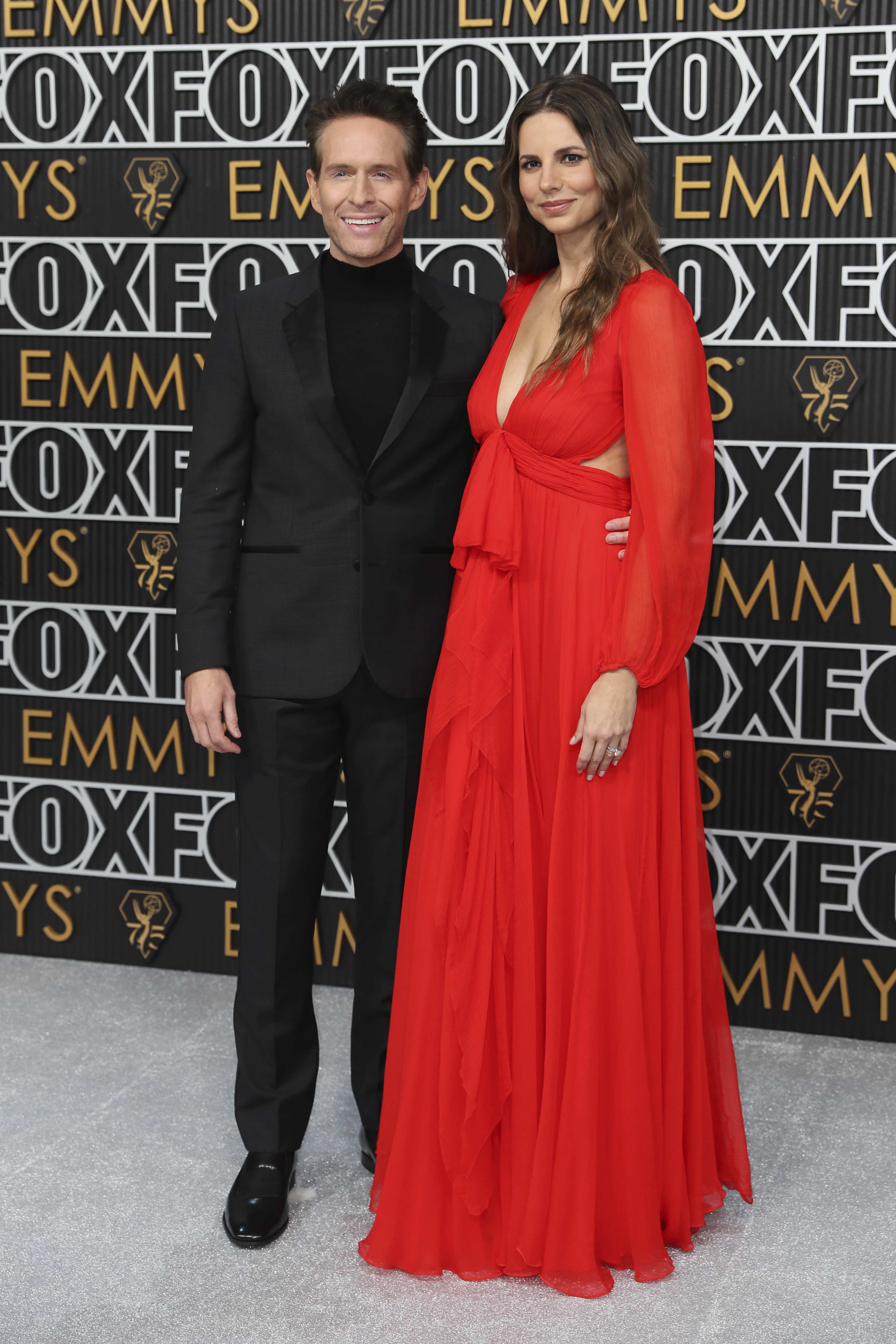 Glenn Howerton, left, and Jill Latiano pose for a Red Carpet portrait at the 75th Emmy Awards on Monday, Jan. 15, 2024 at the Peacock Theater in Los Angeles. (Photo by Danny Moloshok/Invision for the Television Academy/AP Images)