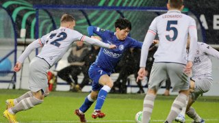 Istanbul Basaksehir's Eden Karzev, left, fights for the ball with Gent's Hyunseok Hong, center, during the Europa Conference League.