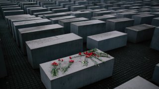 Flowers lie on a concrete slab of the Holocaust Memorial to mark the International Holocaust Remembrance Day