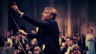 This image released by Netflix shows Bradley Cooper as Leonard Bernstein in a scene from “Maestro.”