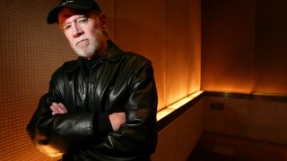 Actor and comedian George Carlin poses in a New York hotel.