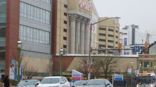 Cars drive along Atlantic Avenue in Atlantic City, N.J. on Jan. 26, 2024, past the AtlanticCare hospital and Caesars casino.