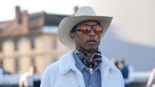Pharrell Williams is seen, outside Dior, during the Menswear Fall/Winter 2024/2025