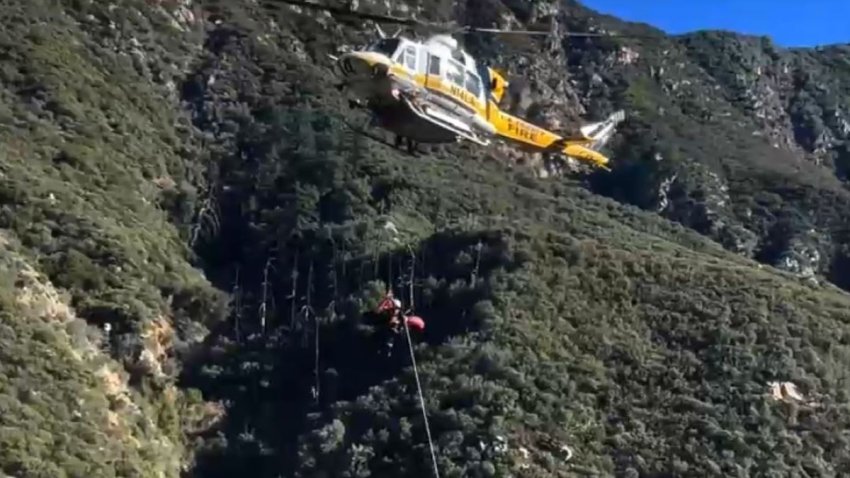 Rescuers airlifted a woman to safety after a crash off Mount Baldy Road in the Southern California mountains.