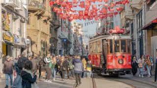 A tram passes shoppers as it travels along Istiklal Street in the Beyoglu district of Istanbul, Turkey, on Tuesday, Dec. 19, 2023.