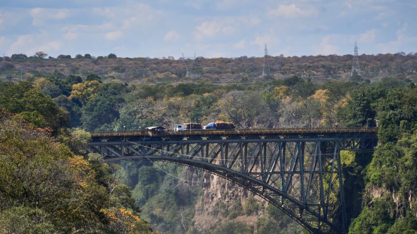 A truck makes its way over the Victoria Falls bridge, spanning over the Zambezi River, linking Zambia and Zimbabwe, in Livingstone, Zambia, on Sunday, May 8, 2022.