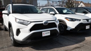 Toyota hybrid vehicles for sale at a dealership in Chicago, Feb. 6, 2024.