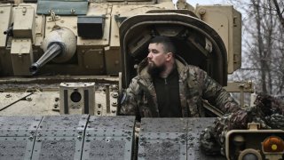 A Ukrainian serviceman of the 47th Mechanized Brigade prepares for combat a Bradley fighting vehicle, not far away from Avdiivka, Donetsk region on February 11, 2024, amid the Russian invasion of Ukraine. 