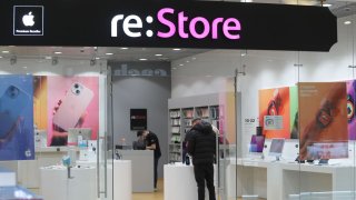 People stand in a “re:store,” an Apple resale store in a shopping center in St. Petersburg. Apple has suspended sales of its products in Russia because of Russia’s war of aggression against Ukraine. 