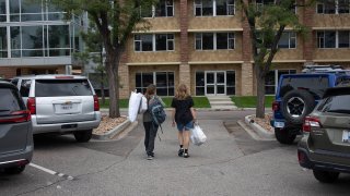 An incoming college first-year student, moves into her college dormitory
